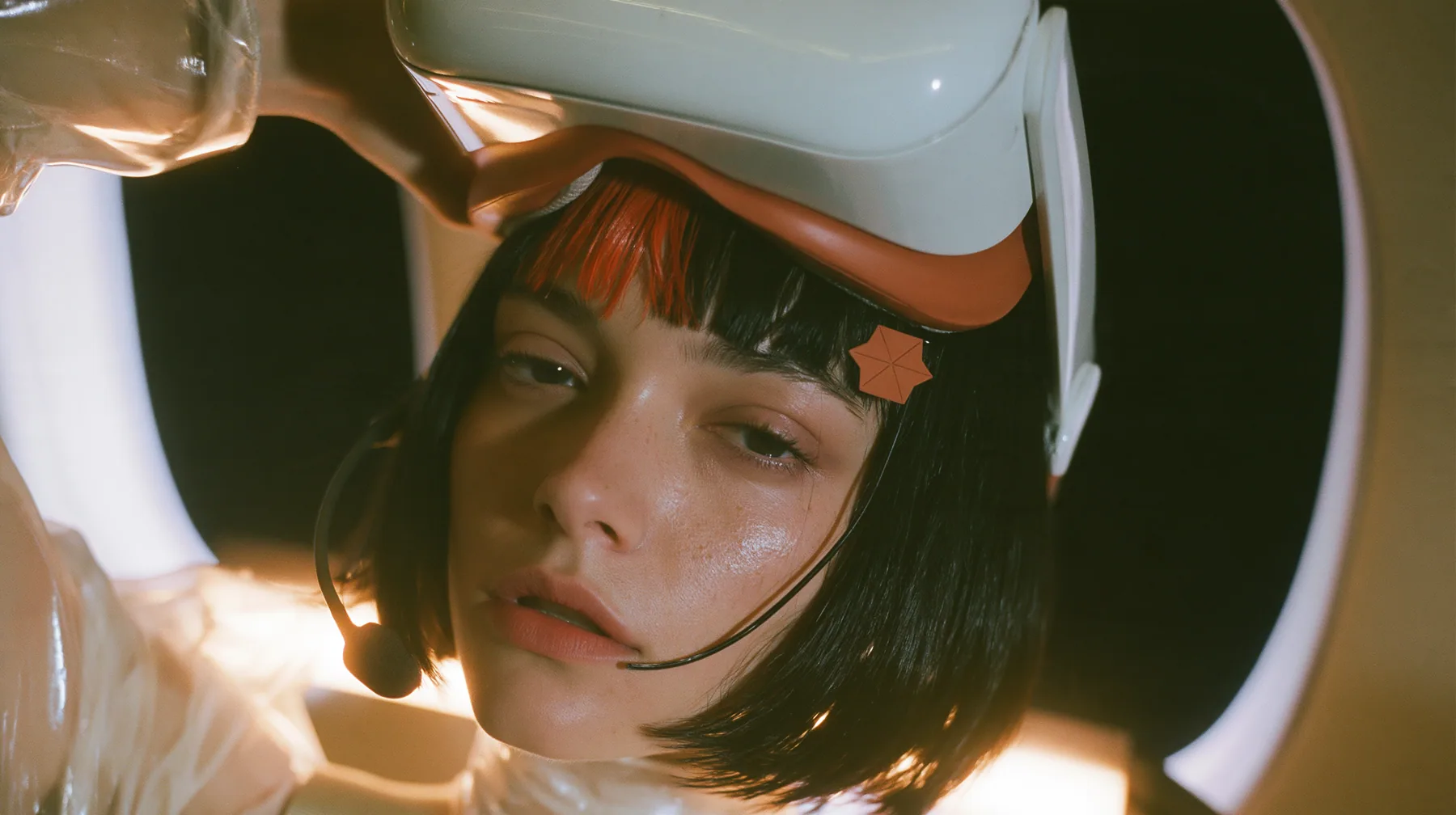Jet-set high fashion editorial, a couture magazine story shot on a night flight: a close-up of a Caucasian American woman in her late twenties with a grown-up angular face, defined cheekbones and a strong jawline,…