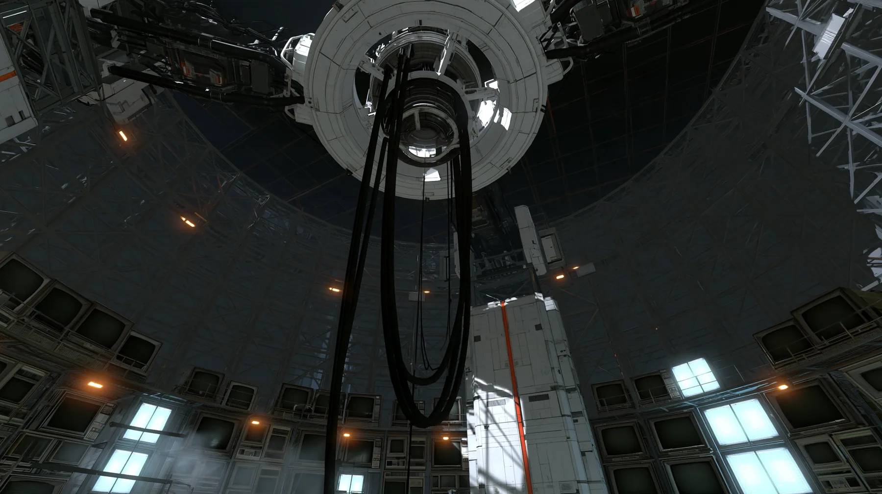a vast dark circular machine chamber, a huge white ring mount on the ceiling with thick black cables hanging down where a robot used to hang, the curved grey lattice walls lined floor to ceiling with dozens of old…