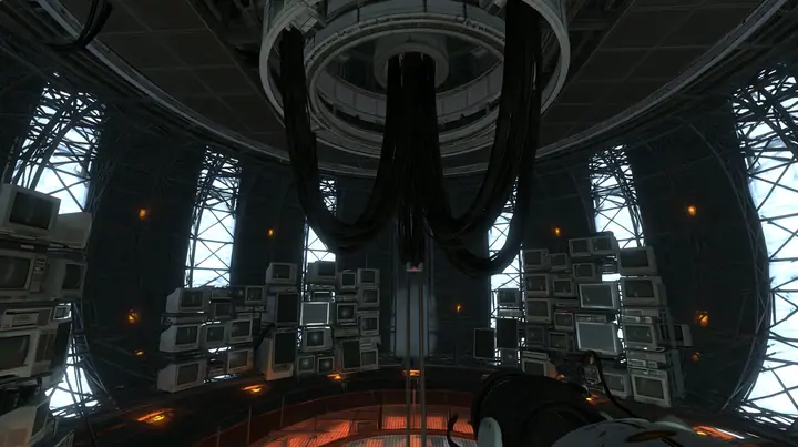 Portal 2 (2011) Source engine screenshot, Valve, the empty Aperture Science central AI chamber: the ceiling ring mount with thick black cables hanging down, dozens of old CRT monitors and flat panel screens stacked…