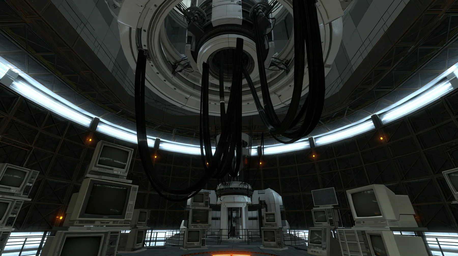 Portal 2 (2011) Source engine screenshot, Valve, the empty Aperture Science central AI chamber: the ceiling ring mount with thick black cables hanging down, dozens of old CRT monitors and flat panel screens stacked…