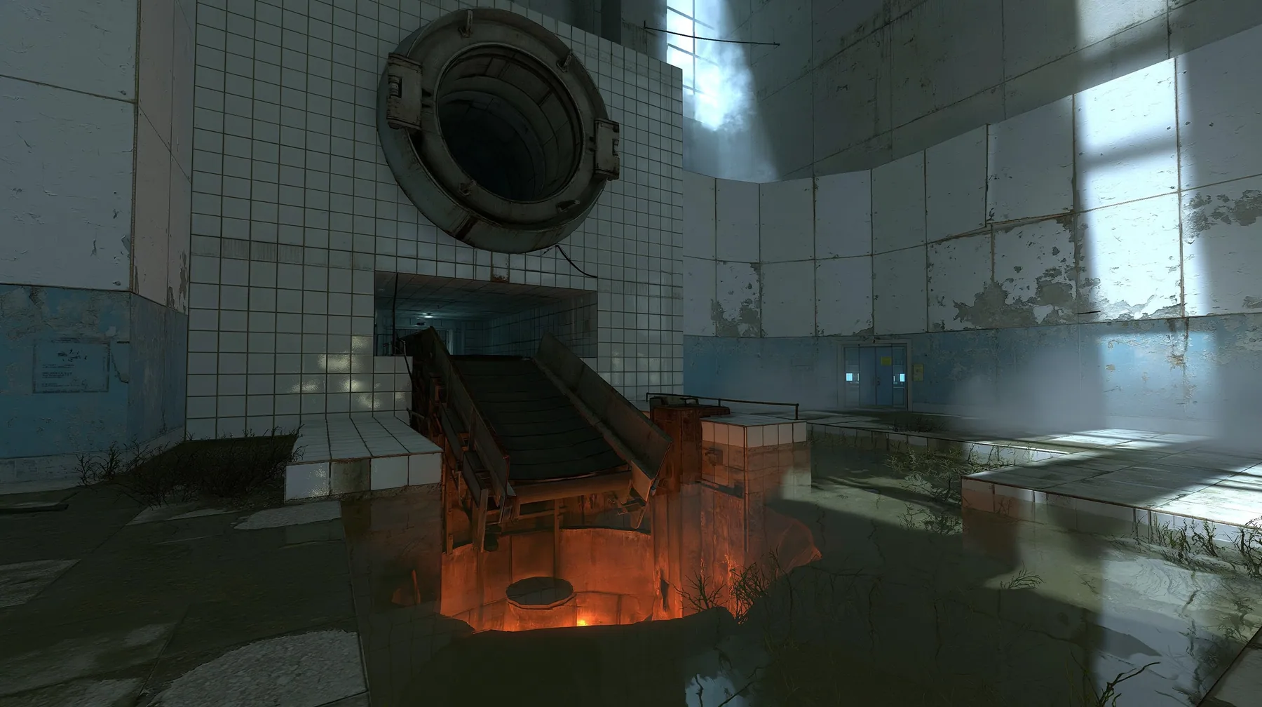 a derelict industrial disposal room, a large round hatch in a tiled wall above a sloped conveyor chute dropping into a pit glowing orange from an incinerator below, shallow murky water on the floor, peeling white…