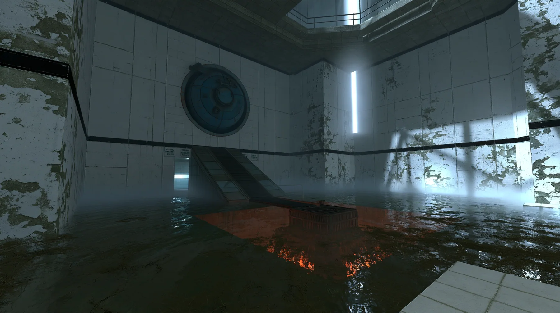 Portal 2 (2011) Source engine screenshot, Valve, a derelict Aperture Science disposal room: a big round chute hatch in the panelled wall above a sloped conveyor dropping into a glowing orange incinerator pit, flooded…