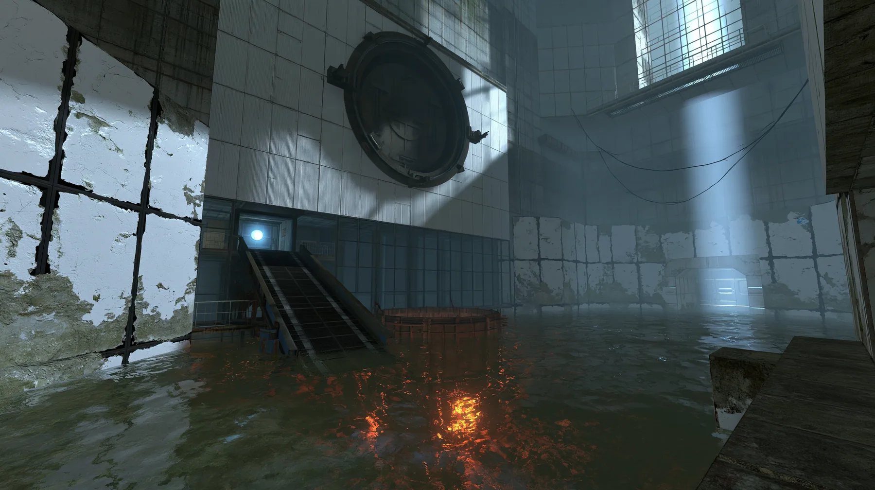 Portal 2 (2011) Source engine screenshot, Valve, a derelict Aperture Science disposal room: a big round chute hatch in the panelled wall above a sloped conveyor dropping into a glowing orange incinerator pit, flooded…