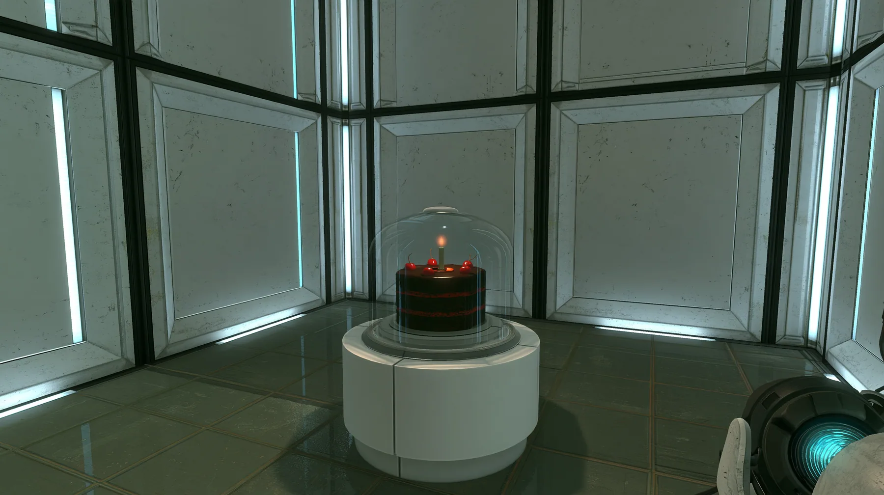 Portal 2 (2011) Source engine screenshot, Valve, a clean Aperture Science test chamber of white concrete panels with black seams and vertical light strips, a black forest chocolate cake with cherries and one lit…