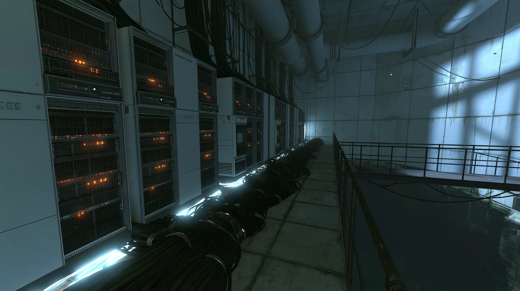 Portal 2 (2011) Source engine screenshot, Valve, behind the scenes at Aperture Science: a long concrete corridor lined with tall 1970s mainframe server cabinets with blinking lights, thick black cable bundles along…