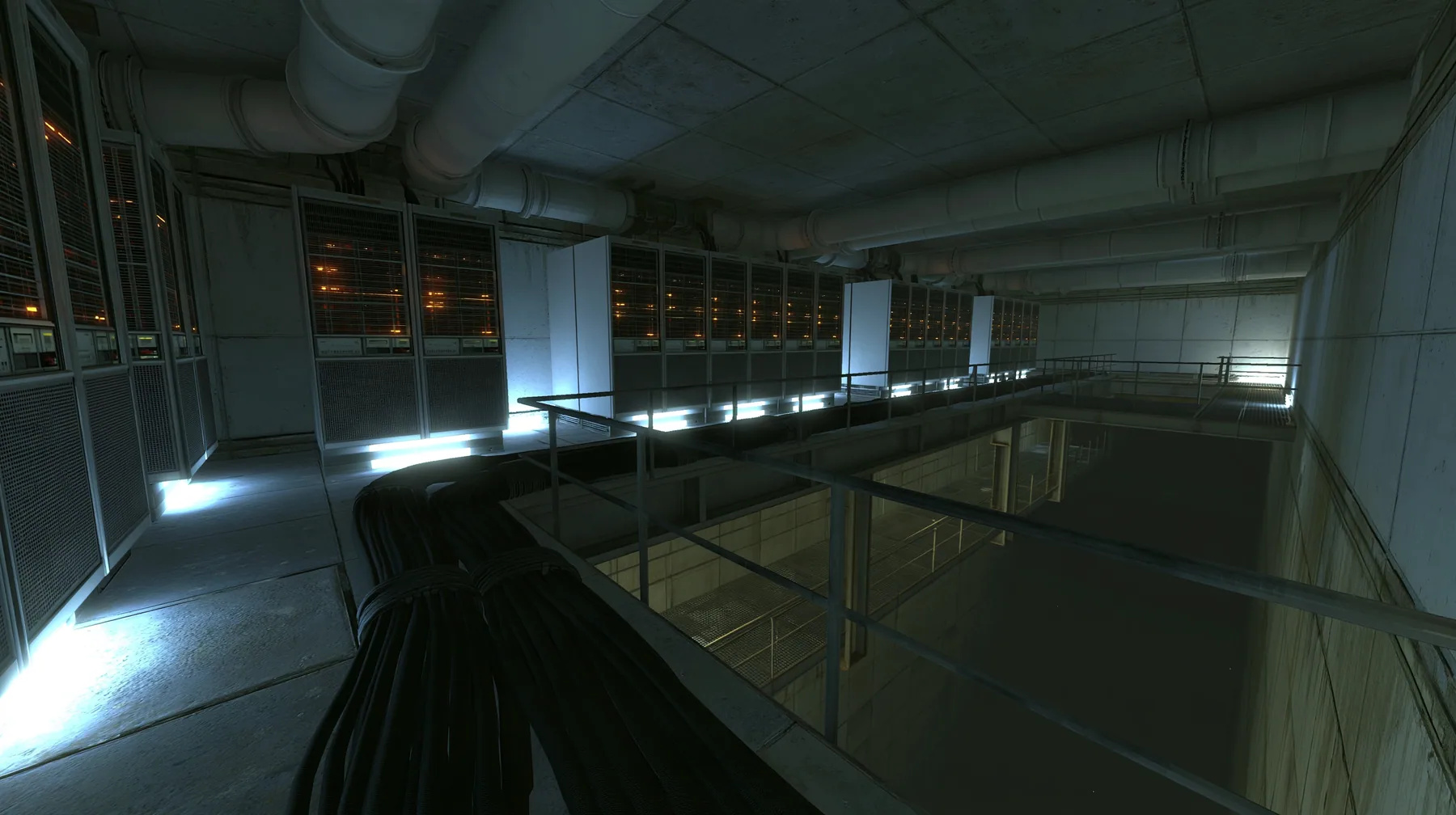 Portal 2 (2011) Source engine screenshot, Valve, behind the scenes at Aperture Science: a long concrete corridor lined with tall 1970s mainframe server cabinets with blinking lights, thick black cable bundles along…