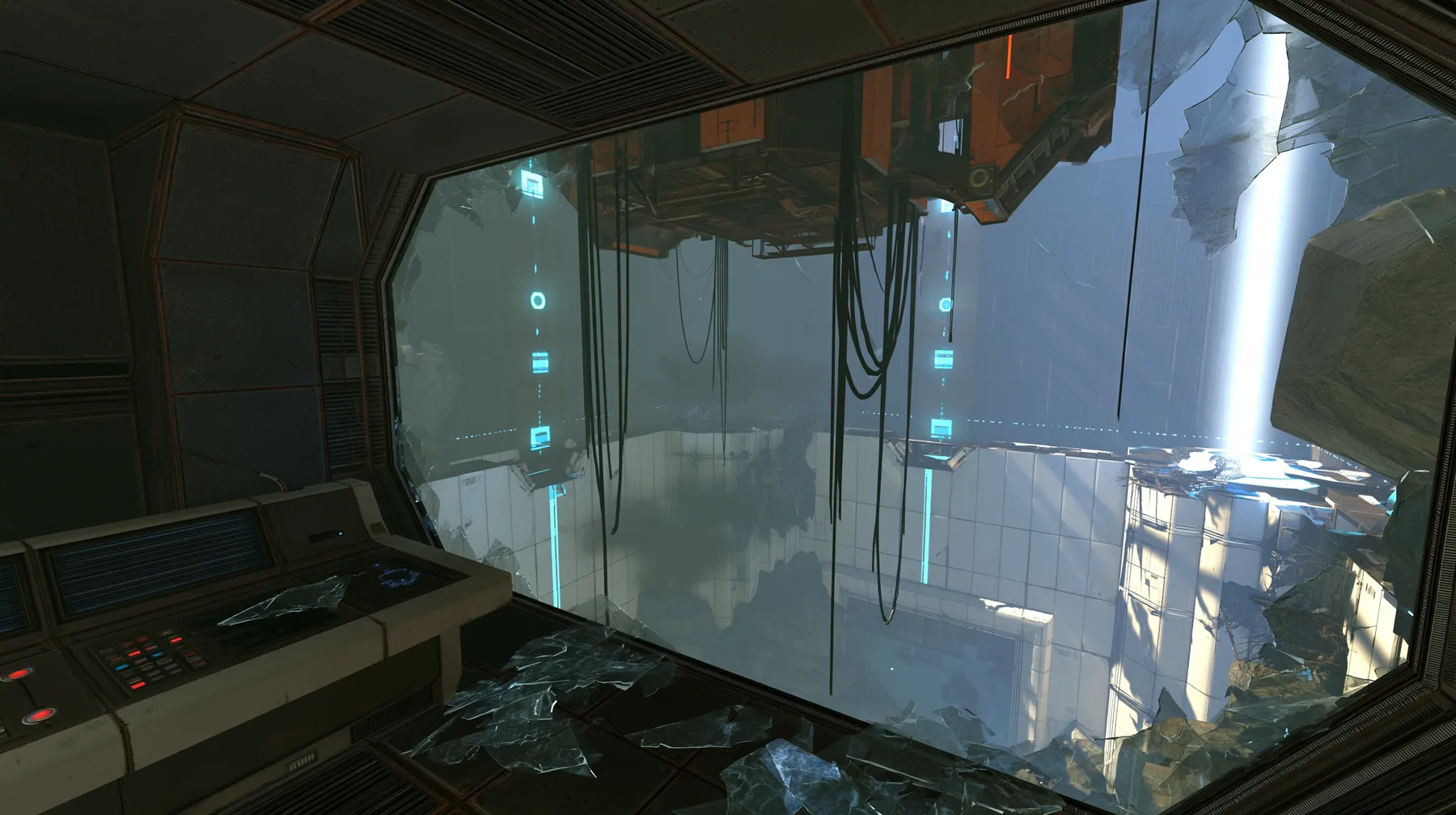inside a dark control booth high above a test chamber, its big observation window smashed outward, shards of glass on the console and floor, a ruined white panelled chamber below, hanging cables, cyan indicator…