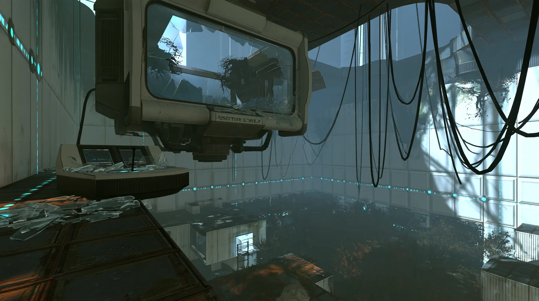 Portal 2 (2011) Source engine screenshot, Valve, an Aperture Science observation booth high above a test chamber, its big window smashed, glass shards on the console and floor, the decaying white panelled chamber…
