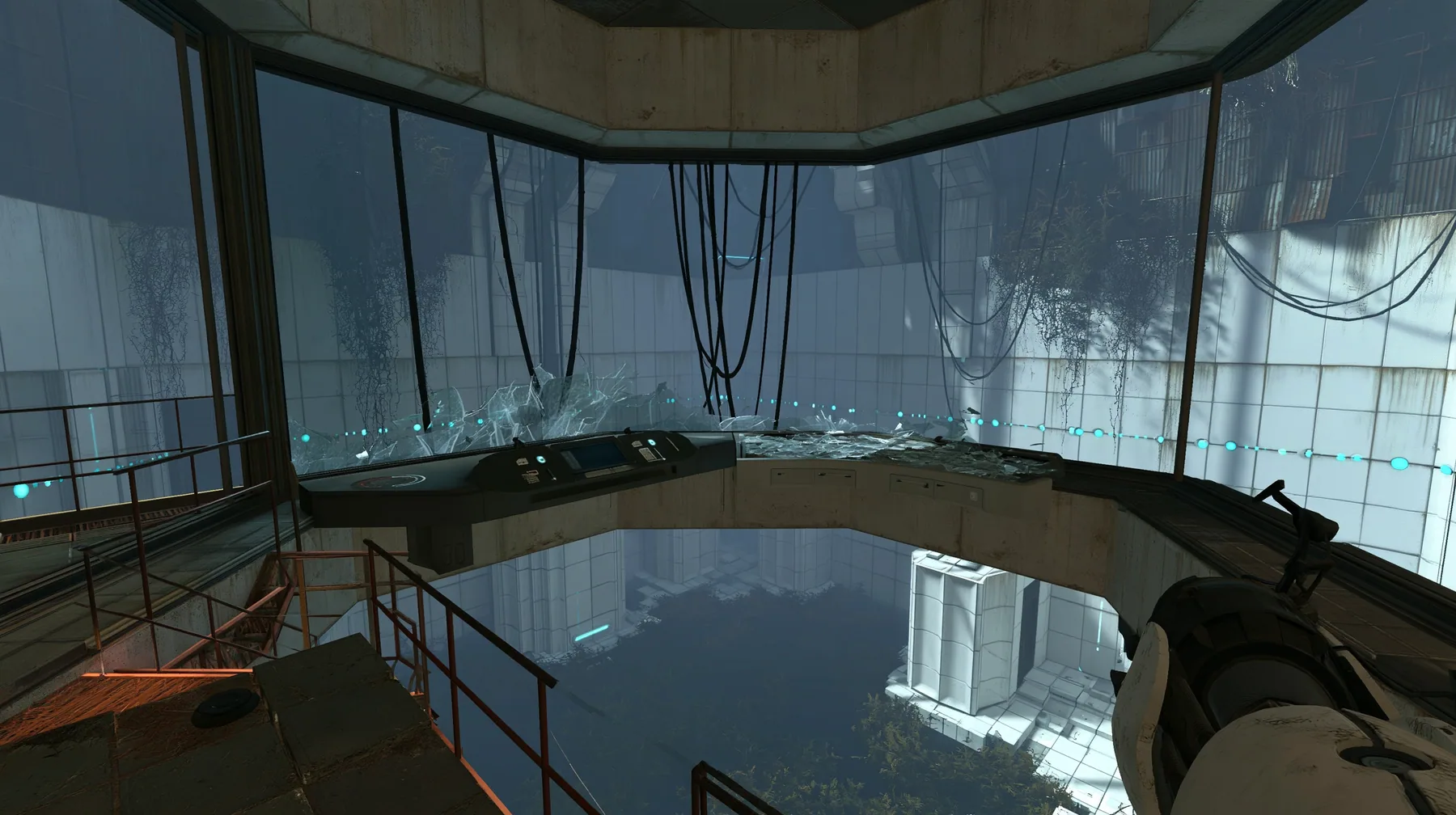 Portal 2 (2011) Source engine screenshot, Valve, an Aperture Science observation booth high above a test chamber, its big window smashed, glass shards on the console and floor, the decaying white panelled chamber…