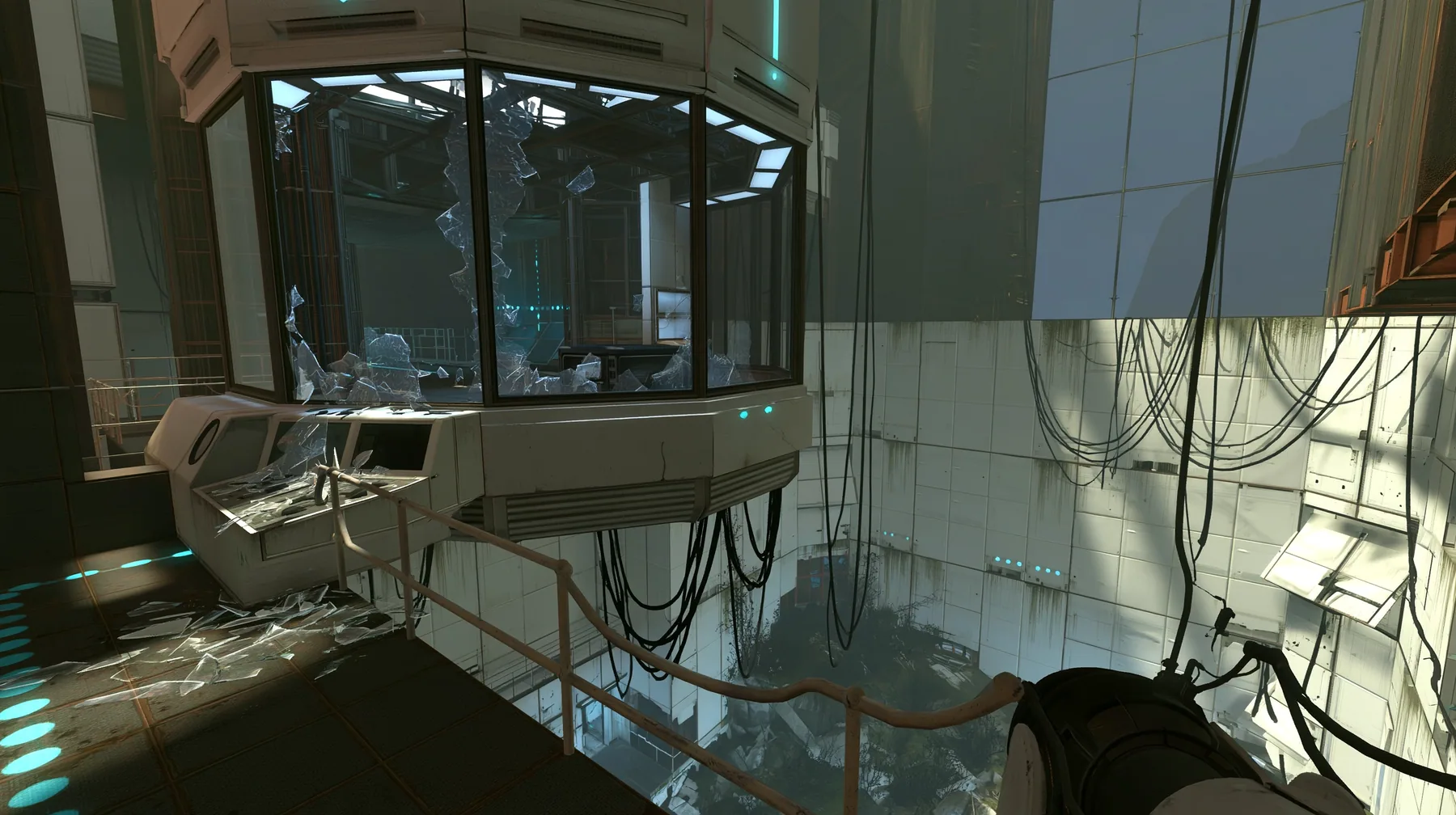 Portal 2 (2011) Source engine screenshot, Valve, an Aperture Science observation booth high above a test chamber, its big window smashed, glass shards on the console and floor, the decaying white panelled chamber…