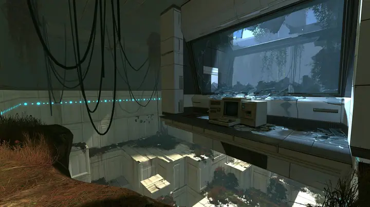 Portal 2 (2011) Source engine screenshot, Valve, an Aperture Science observation booth high above a test chamber, its big window smashed, glass shards on the console and floor, the decaying white panelled chamber…