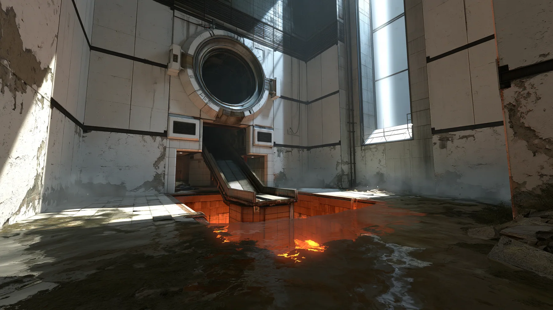 Valve's Portal 2 (2011), a Source engine screenshot: a derelict Aperture Science disposal room: a big round chute hatch in the panelled wall above a sloped conveyor dropping into a glowing orange incinerator pit,…