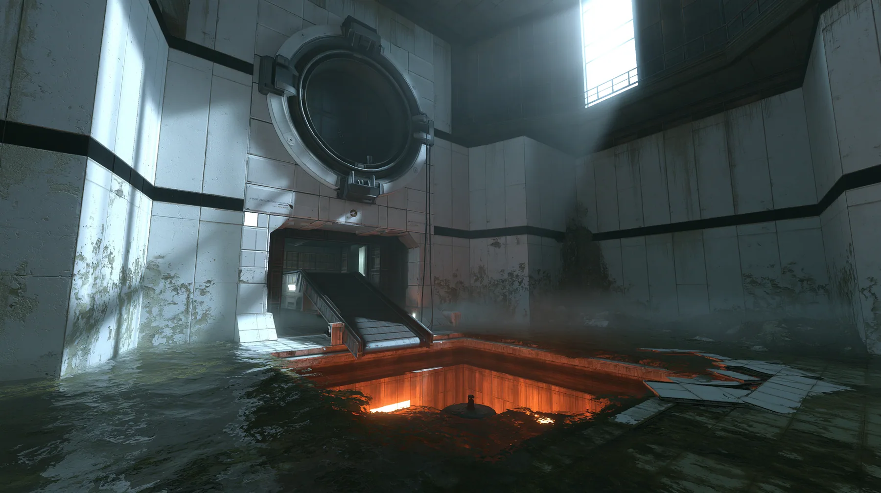 Valve's Portal 2 (2011), a Source engine screenshot: a derelict Aperture Science disposal room: a big round chute hatch in the panelled wall above a sloped conveyor dropping into a glowing orange incinerator pit,…