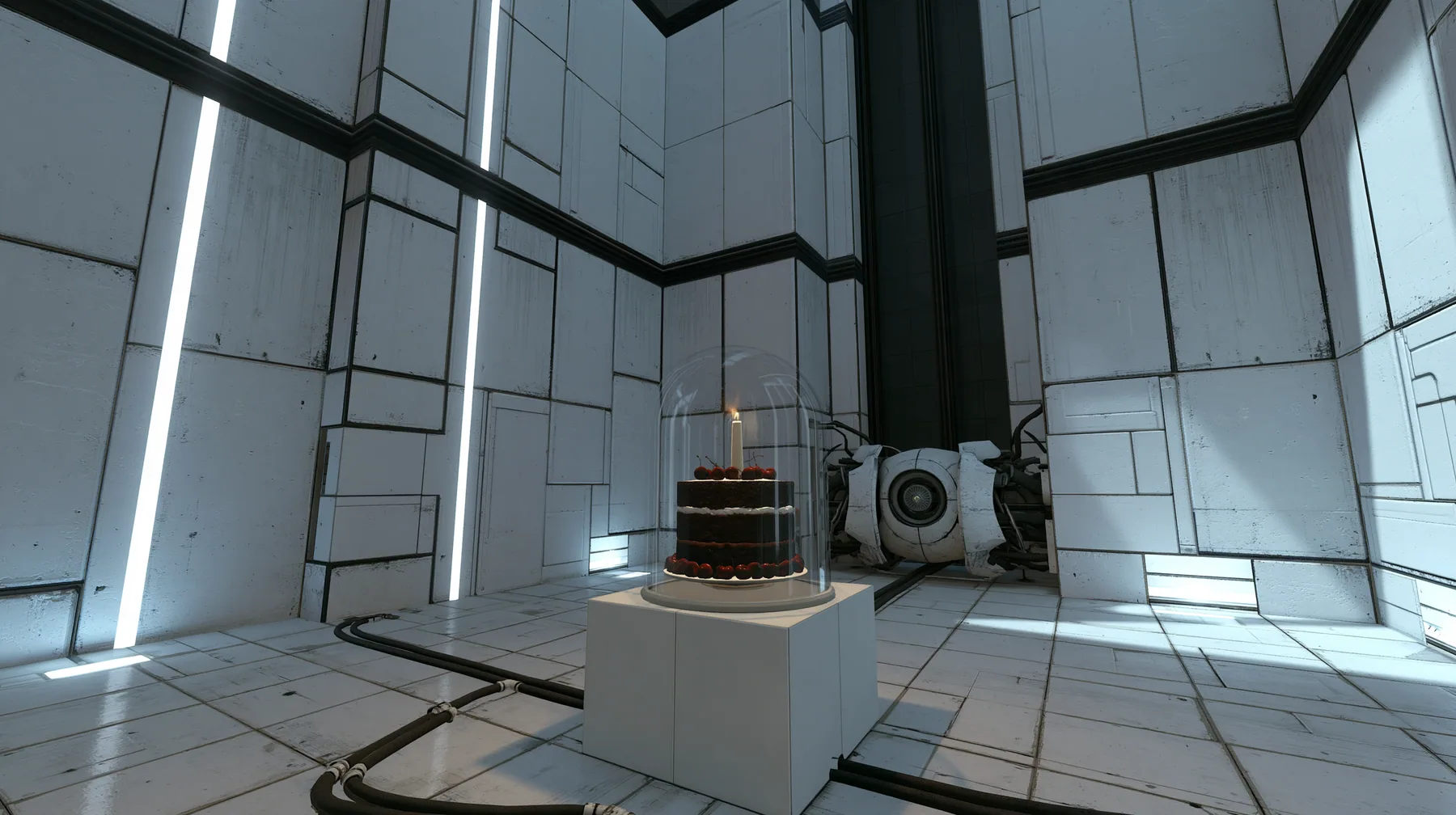 Valve's Portal 2 (2011), a Source engine screenshot: a clean Aperture Science test chamber of white concrete panels with black seams and vertical light strips, a black forest chocolate cake with cherries and one lit…