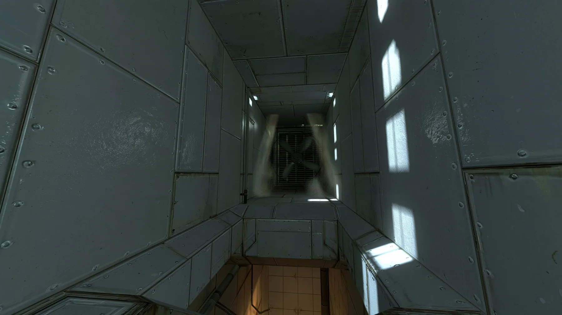 Portal 2 (2011) Source engine screenshot, Valve, inside a square Aperture Science ventilation duct, grey metal walls with rivets and seams, a spinning fan grille at the far end throwing beams of light through dust, a…