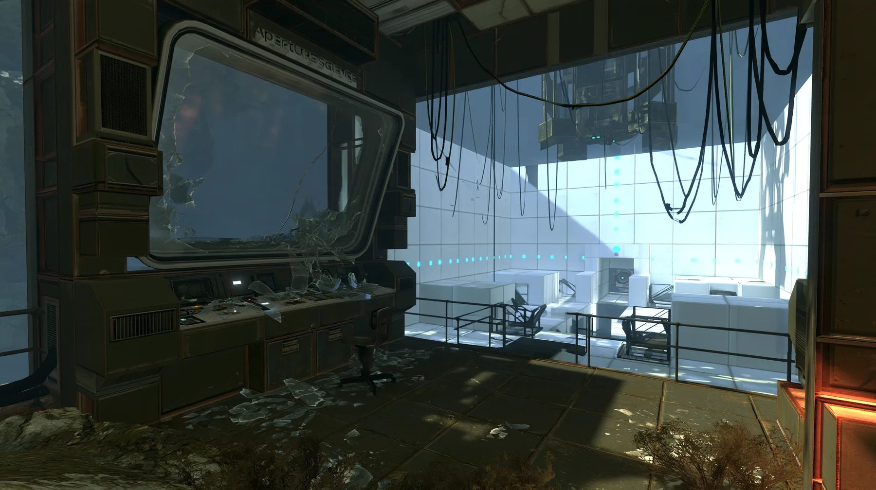 Portal 2 (2011) Source engine screenshot, Valve, a dark Aperture Science observation booth above a white test chamber, its big window smashed outward, glass shards across the console and the floor, the bright chamber…