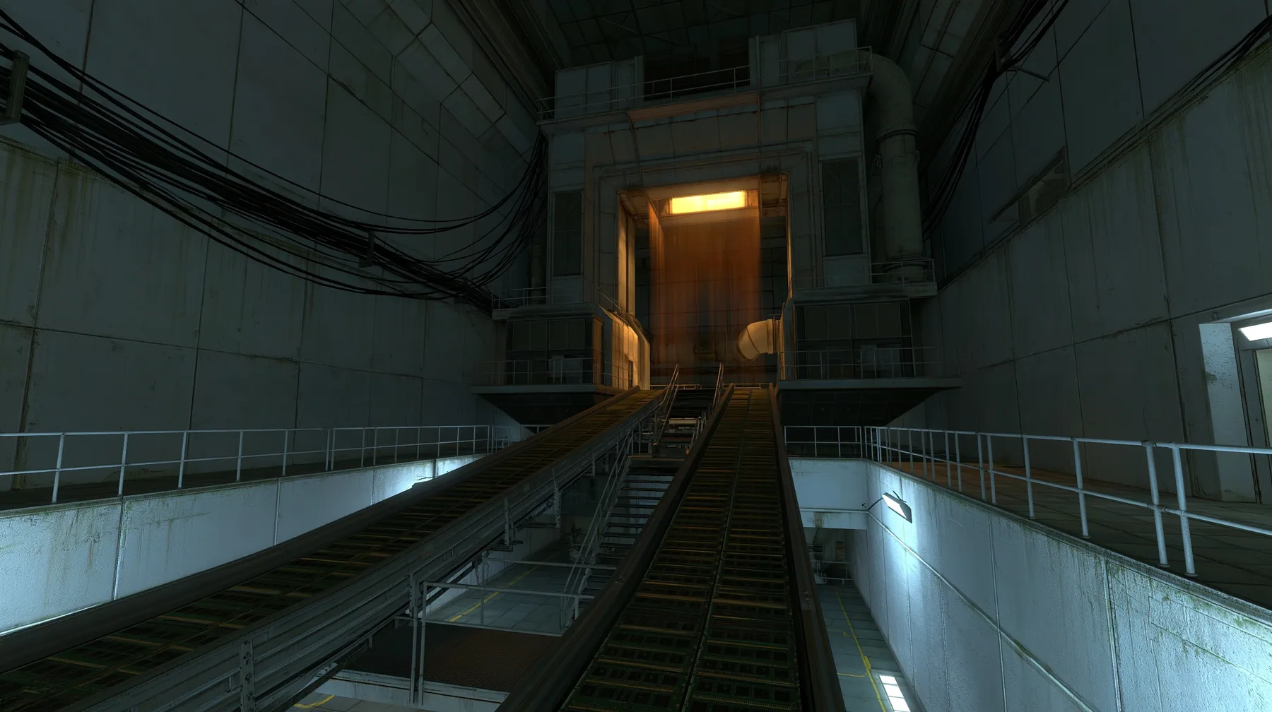 Portal 2 (2011) Source engine screenshot, Valve, behind the scenes at Aperture Science: long conveyor belts carrying thousands of RAM memory sticks up into a huge glowing machine intake, amber light pouring out,…