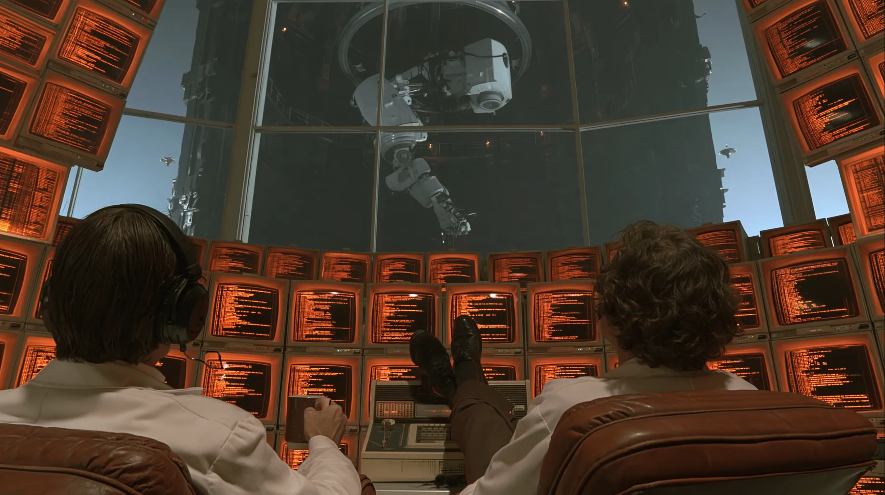 cinematic film still from behind: a curly-haired scientist in a white lab coat leans back in a leather chair, feet up on a retro control console, coffee mug in hand, facing a curved wall of amber CRT monitors full of…
