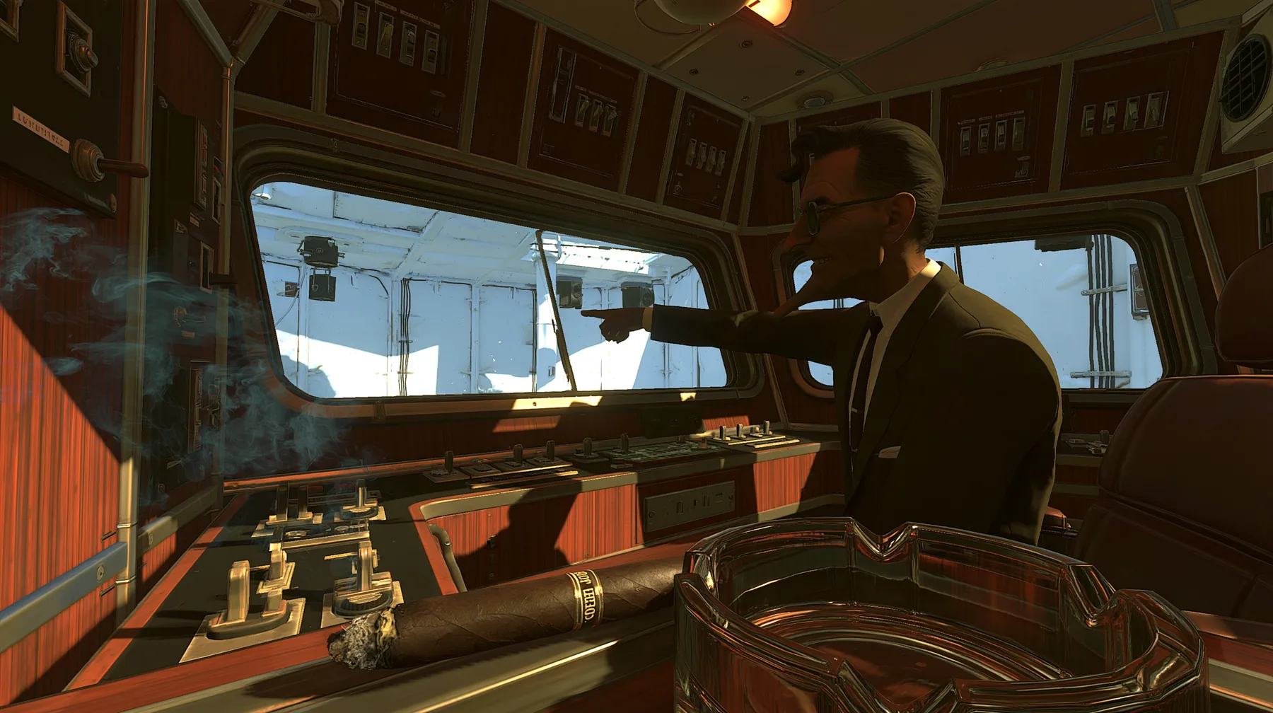 low angle from the edge of a 1950s observation booth console: a lean grinning executive with a long face, high cheekbones, a long straight nose, a big toothy showman's grin, a dark wavy pompadour, a charcoal suit and…