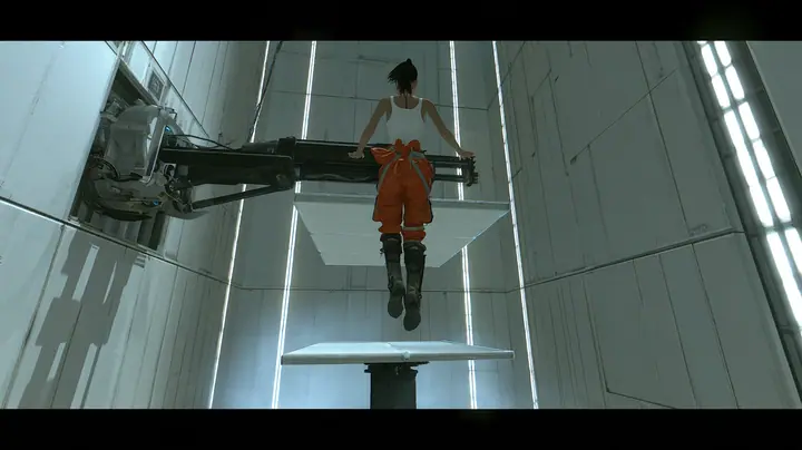 dramatic low-angle film still inside a tall white Portal 2 test chamber: at the top of her flight a woman in a white tank top and an orange jumpsuit tied at the waist, dark ponytail, long-fall boots, seen from behind…