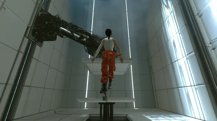 dramatic low-angle film still inside a tall white Portal 2 test chamber: at the top of her flight a woman in a white tank top and an orange jumpsuit tied at the waist, dark ponytail, long-fall boots, seen from behind…
