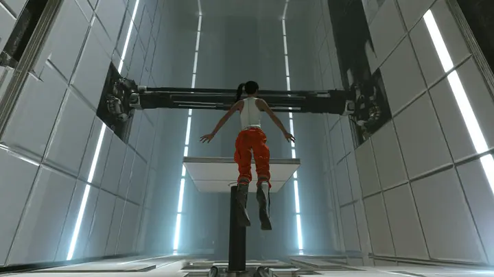 dramatic low-angle film still inside a tall white Portal 2 test chamber: at the top of her flight a woman in a white tank top and an orange jumpsuit tied at the waist, dark ponytail, long-fall boots, seen from behind…