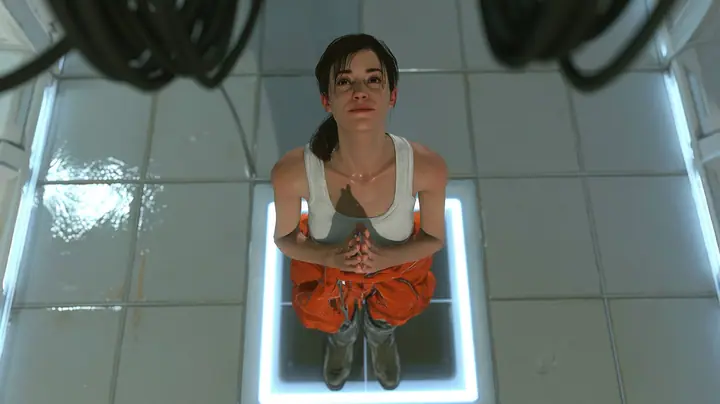top-down cinematic still from the robot's point of view high above a white test chamber: the test subject, a woman of about 30 with a dark brown ponytail, white tank top and orange jumpsuit tied around her waist,…