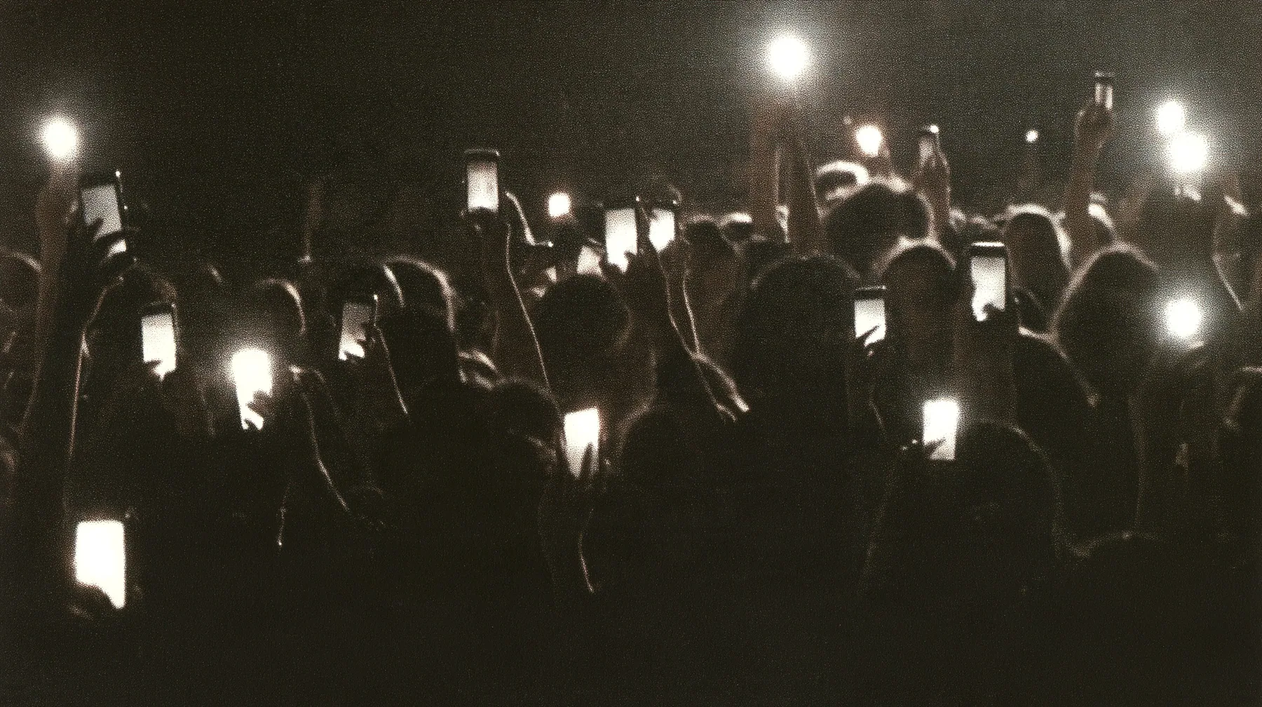 a 1-bit ordered-dither photocopy of a crowd of silhouetted fashion-show guests holding up glowing phones, coarse dither in black toner on off-white paper, copier edge burn, one scanline drop-out band, no grey tones,…