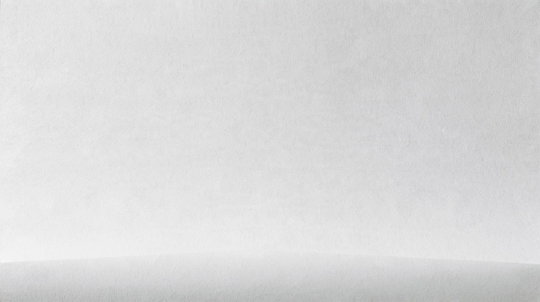 an empty sheet of grey xerox paper photographed flat, toner grain and faint scanner streaks, a hairline crop mark and a registration target near one corner, a soft fold across the lower third, a large calm field for…