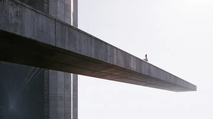 a long concrete catwalk tilting upward and lifting off into a pure white overexposed sky, the dark server hall falling away below, a small figure in a pleated skirt at the far end with the wind in her clothes,…