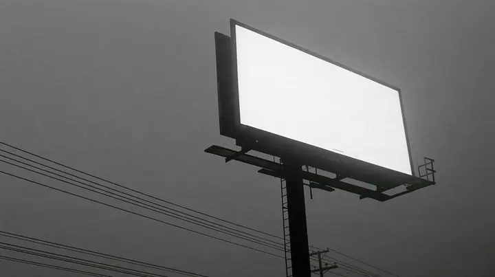 looking up at a huge blank white billboard on a steel pole above the 101 freeway at dawn in thick fog, the billboard face flat and empty, powerlines, grey sky, monochrome, fine grain, no text, no letters, no logos