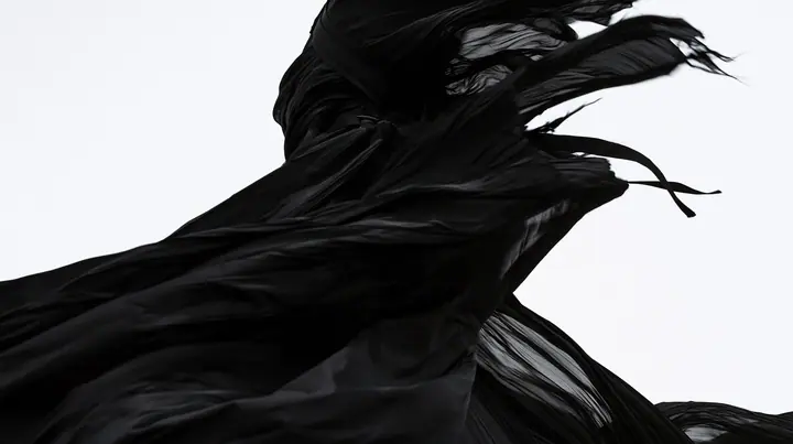 a huge black pleated fabric whipping in wind against a white void, harness straps flying, high-key white void, pure white paper light, hard clean black shadows, monochrome, no text, no letters, no logos
