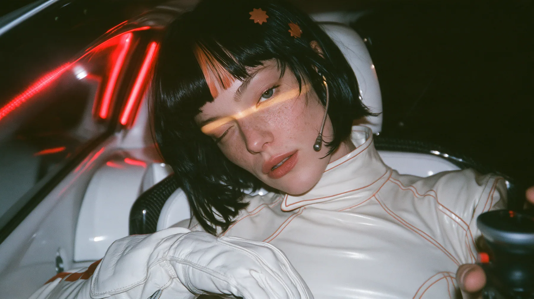 extreme close-up of her eyes and bangs, cropped at the bridge of the nose, a 28-year-old Caucasian American woman with a grown-up angular face, defined cheekbones and a strong jawline, pale skin and light freckles, a…