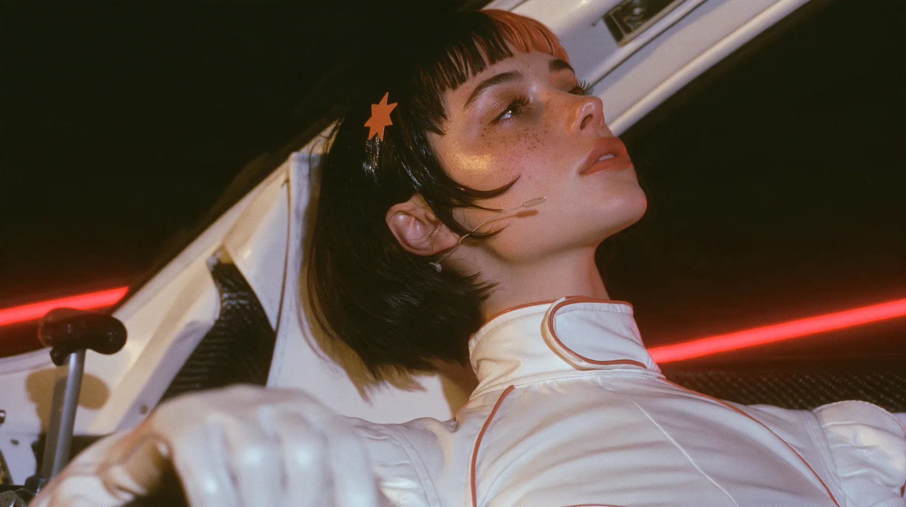 profile close-up, a 28-year-old Caucasian American woman with a grown-up angular face, defined cheekbones and a strong jawline, pale skin and light freckles, a glossy black blunt jaw-length bob with heavy straight…