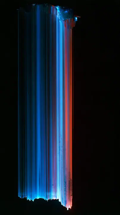 a photograph smeared vertically into long streaks of colour like dragged pixels, deep blues and reds on black, no text, no letters, no logos