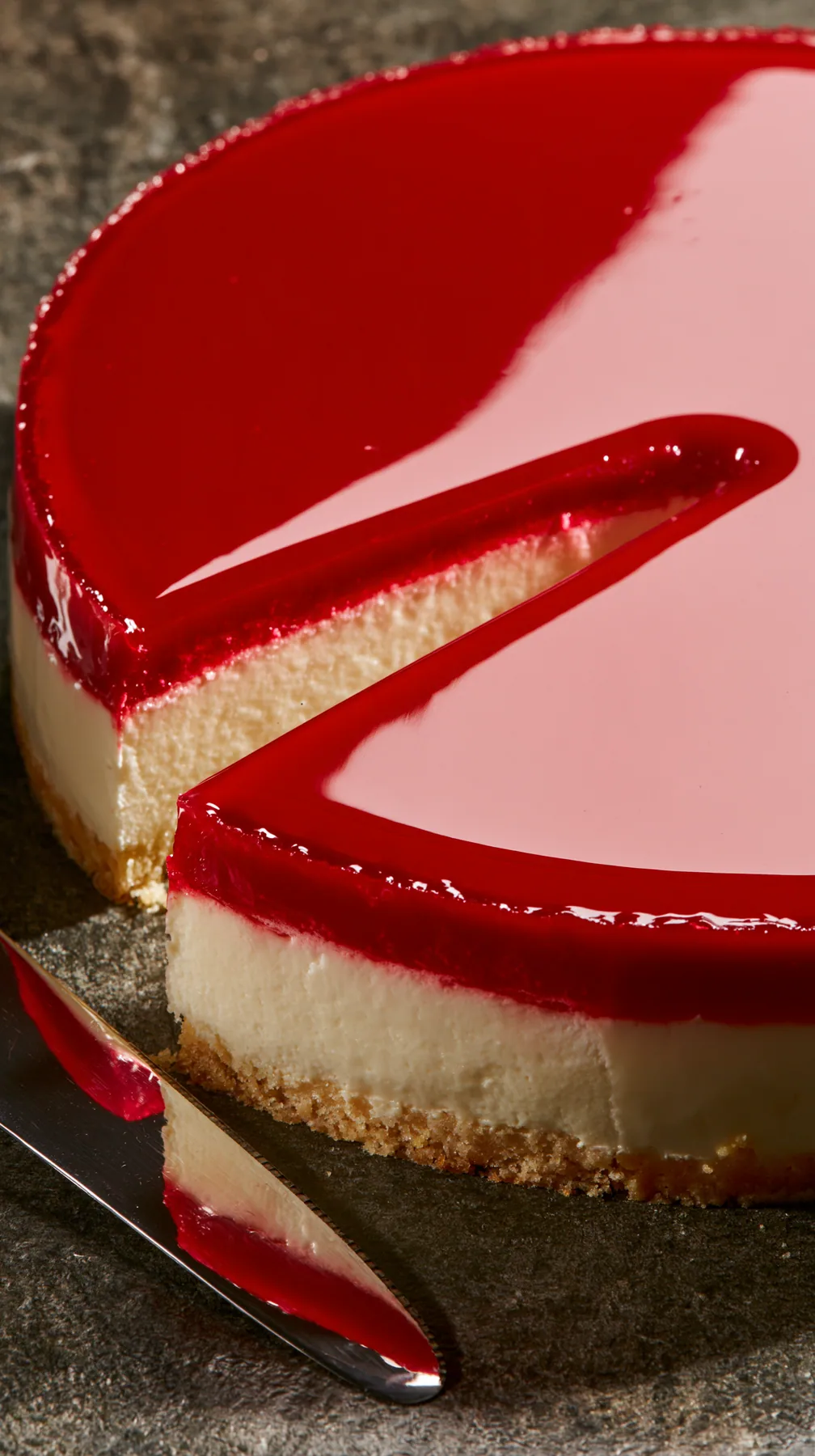 macro of a glossy mirror-glaze cake being sliced, a clean cut, studio light, no text, no letters, no logos