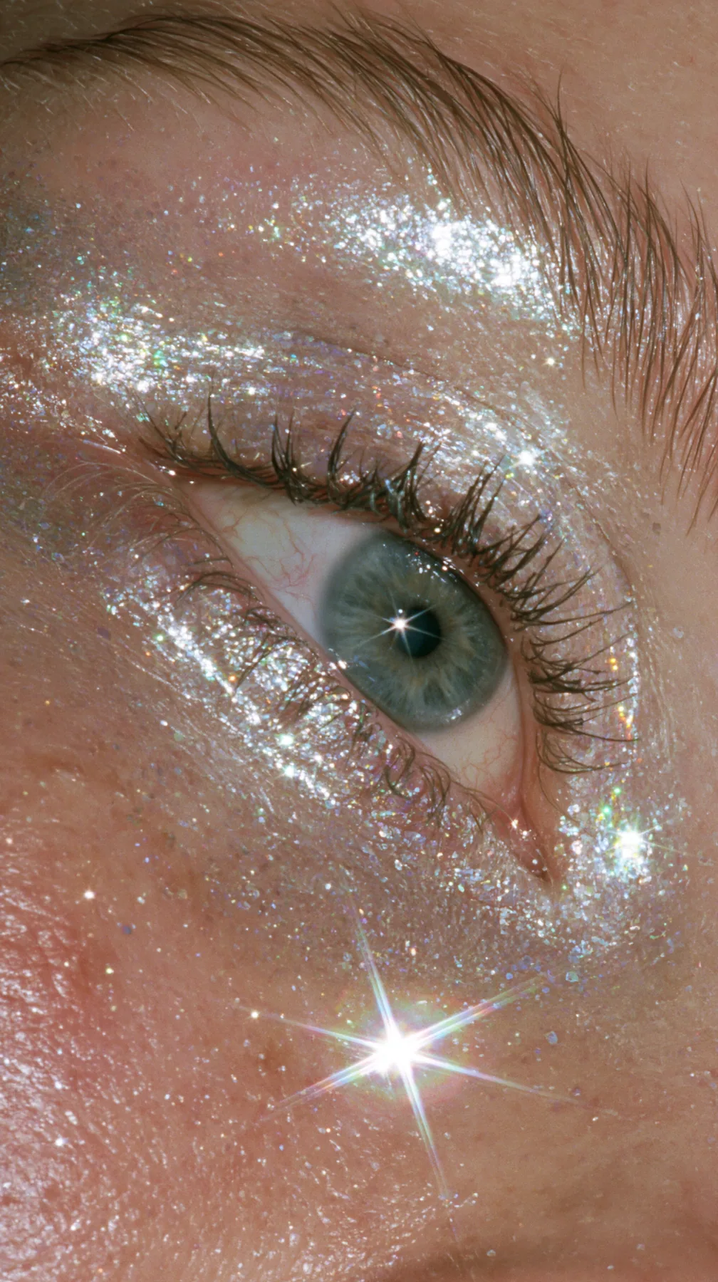macro of iridescent glitter eyeshadow on an eyelid, sparkle, beauty editorial, no text, no letters, no logos