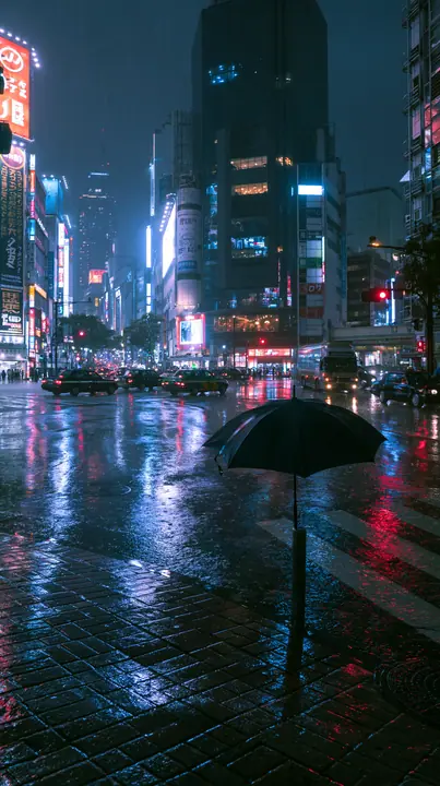 a neon-lit city street in the rain at night, reflections on wet asphalt, a lone umbrella, no text, no letters, no logos
