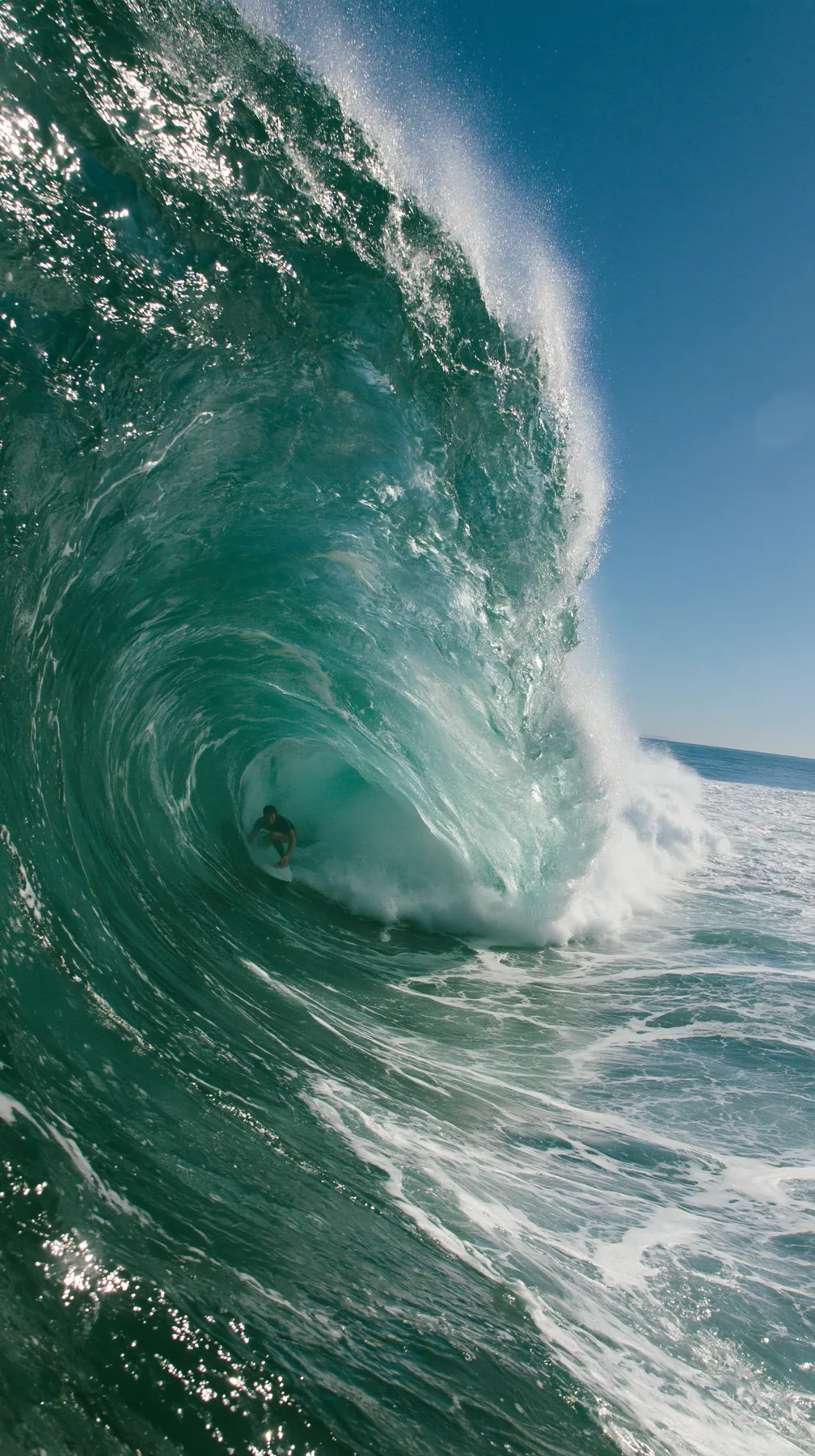 a surfer inside a glassy turquoise barrel wave, sunlit spray, editorial, no text, no letters, no logos