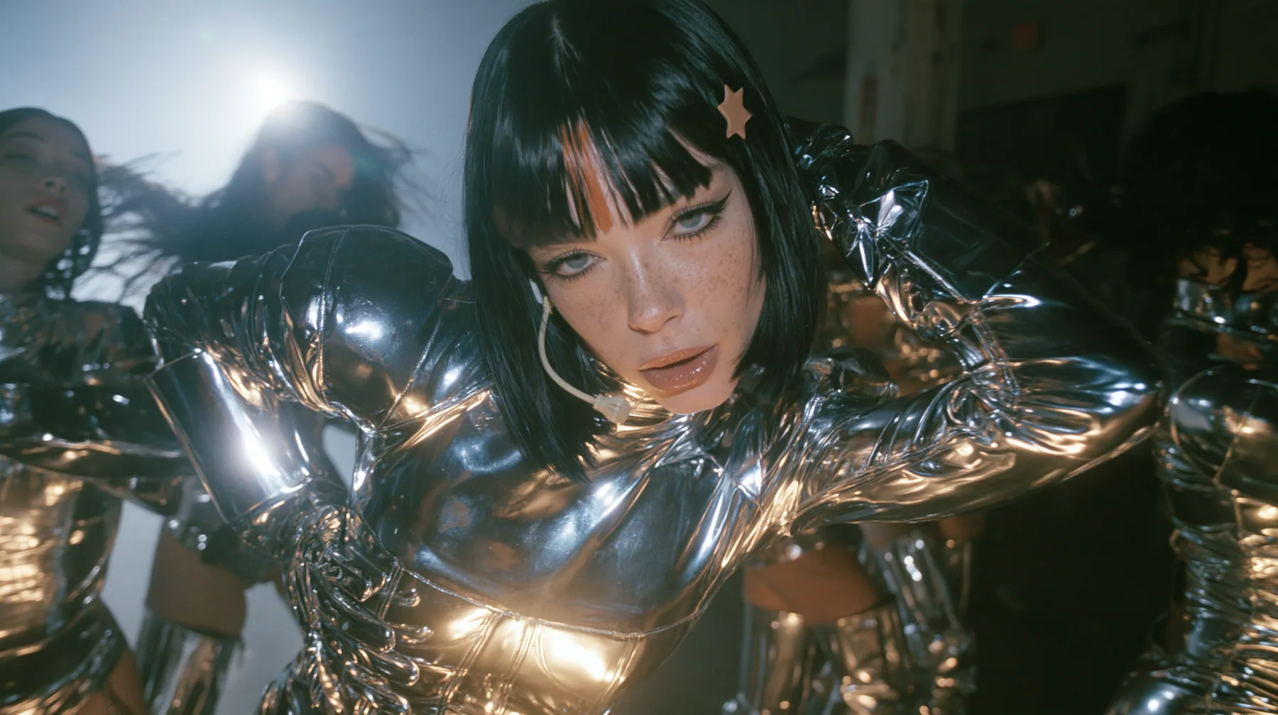full-length shot of a Caucasian American woman in her mid-twenties with pale skin and light freckles, a glossy black blunt jaw-length bob with heavy straight bangs and one clay-orange streak through the bangs, a…
