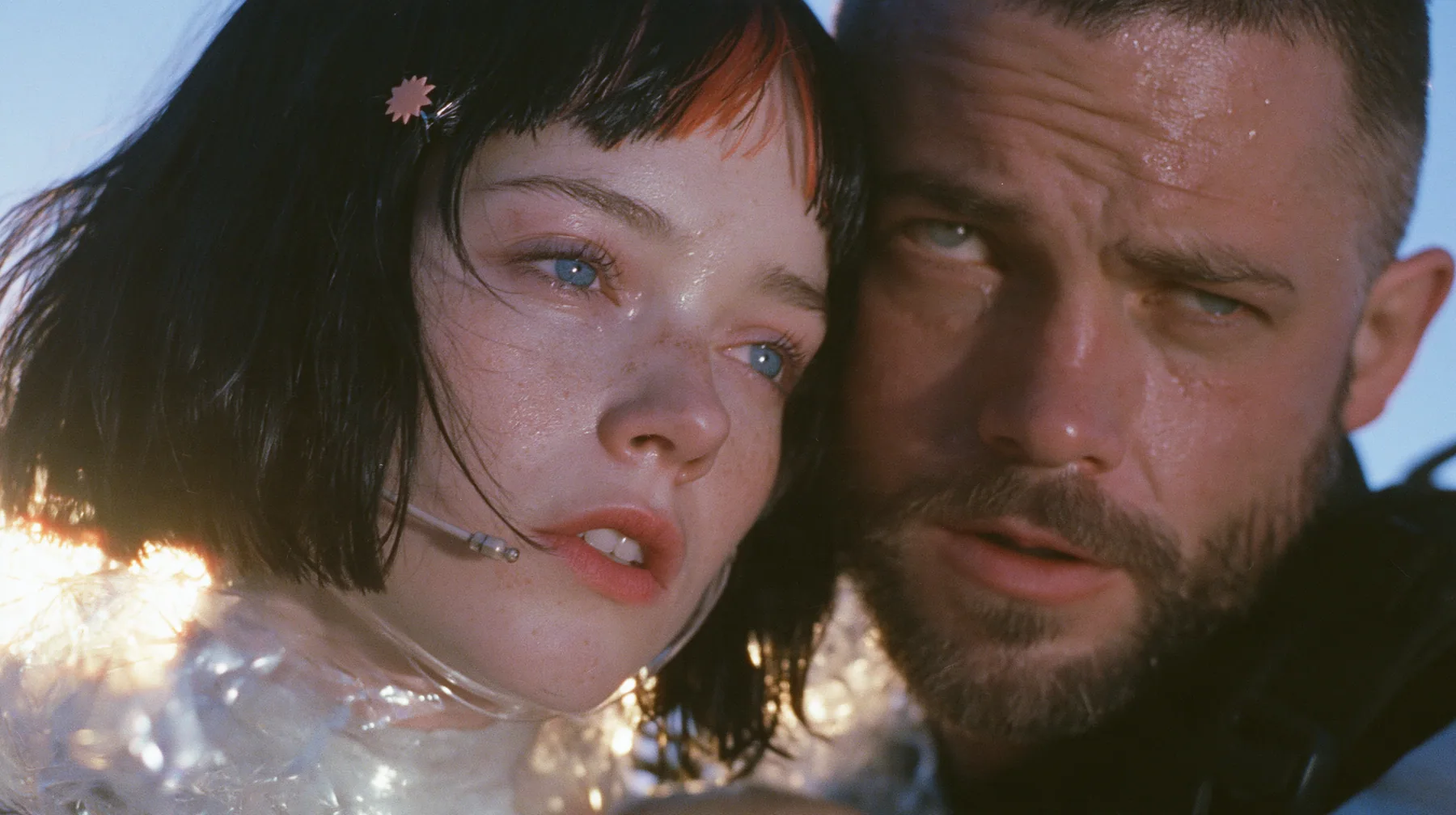 extreme close-up of a Caucasian American woman in her mid-twenties with pale skin and light freckles, a glossy black blunt jaw-length bob with heavy straight bangs and one clay-orange streak through the bangs, a…