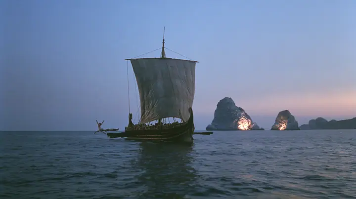 a rower in a linen tunic in a joyous swan dive off the rail of a long black ancient Greek galley with a single mast, a square sail and two banks of oars toward distant glowing rocks, deep blue twilight, the last gold…