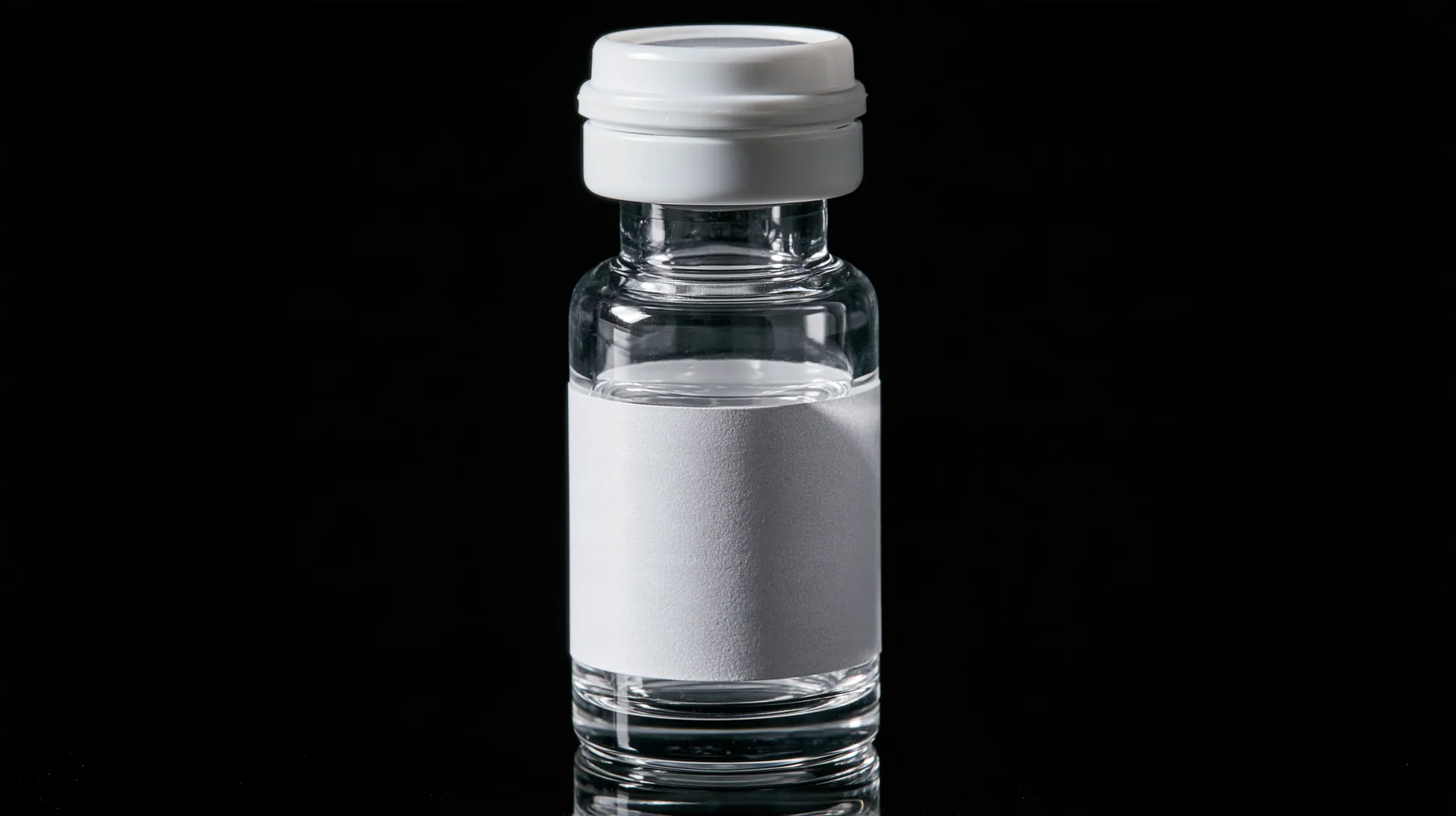 macro product photograph of one small glass peptide vial with a white flip cap and a blank white label on black, a white strobe glint, macro product photograph, hard rim light, razor-thin focus, no text, no letters,…