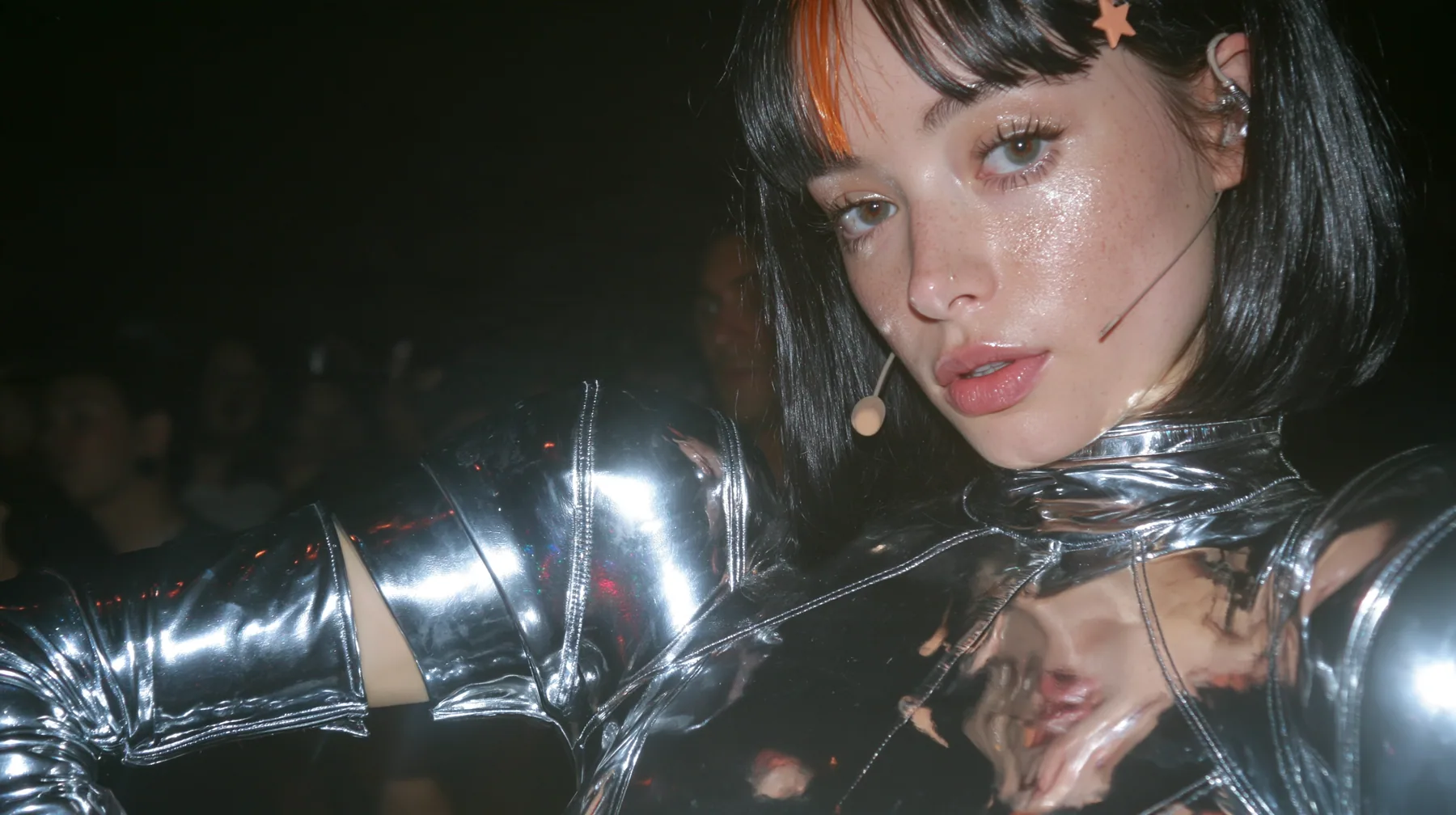 full-length shot of a Caucasian American woman in her mid-twenties with pale skin and light freckles, a glossy black blunt jaw-length bob with heavy straight bangs and one clay-orange streak through the bangs, a…