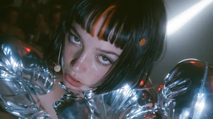full-length shot of a Caucasian American woman in her mid-twenties with pale skin and light freckles, a glossy black blunt jaw-length bob with heavy straight bangs and one clay-orange streak through the bangs, a…