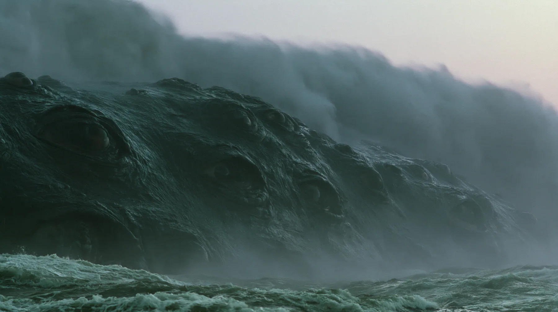 close shot of the glistening black-green flank of a colossal sea creature covered in eyes, a few of them opening, grey first light before sunrise, heavy spray, cinematic 35mm film still, anamorphic, fine grain, no…