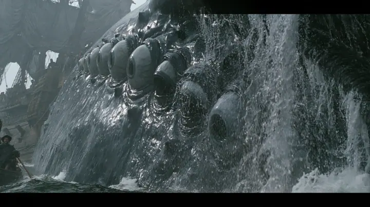 close shot along the flank of a gigantic sea creature breaching beside a wooden galley, its glistening dark skin covered in rows of enormous wet eyes with pale irises, the eyes opening one after another, water…