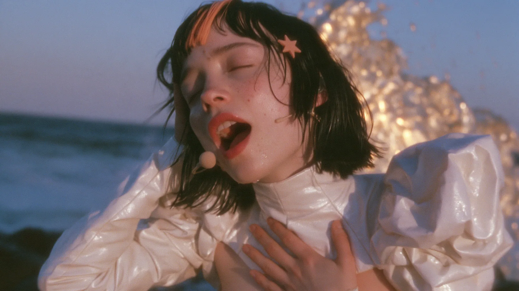 medium close-up of a Caucasian American woman in her mid-twenties with pale skin and light freckles, a glossy black blunt jaw-length bob with heavy straight bangs and one clay-orange streak through the bangs, a small…