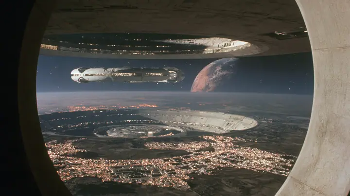 A 35 mm photograph from inside a space colony at night looking out through a vast circular end-cap window: the lit white towns curve around the dark land, and through the window the white capsule-shaped colony's…