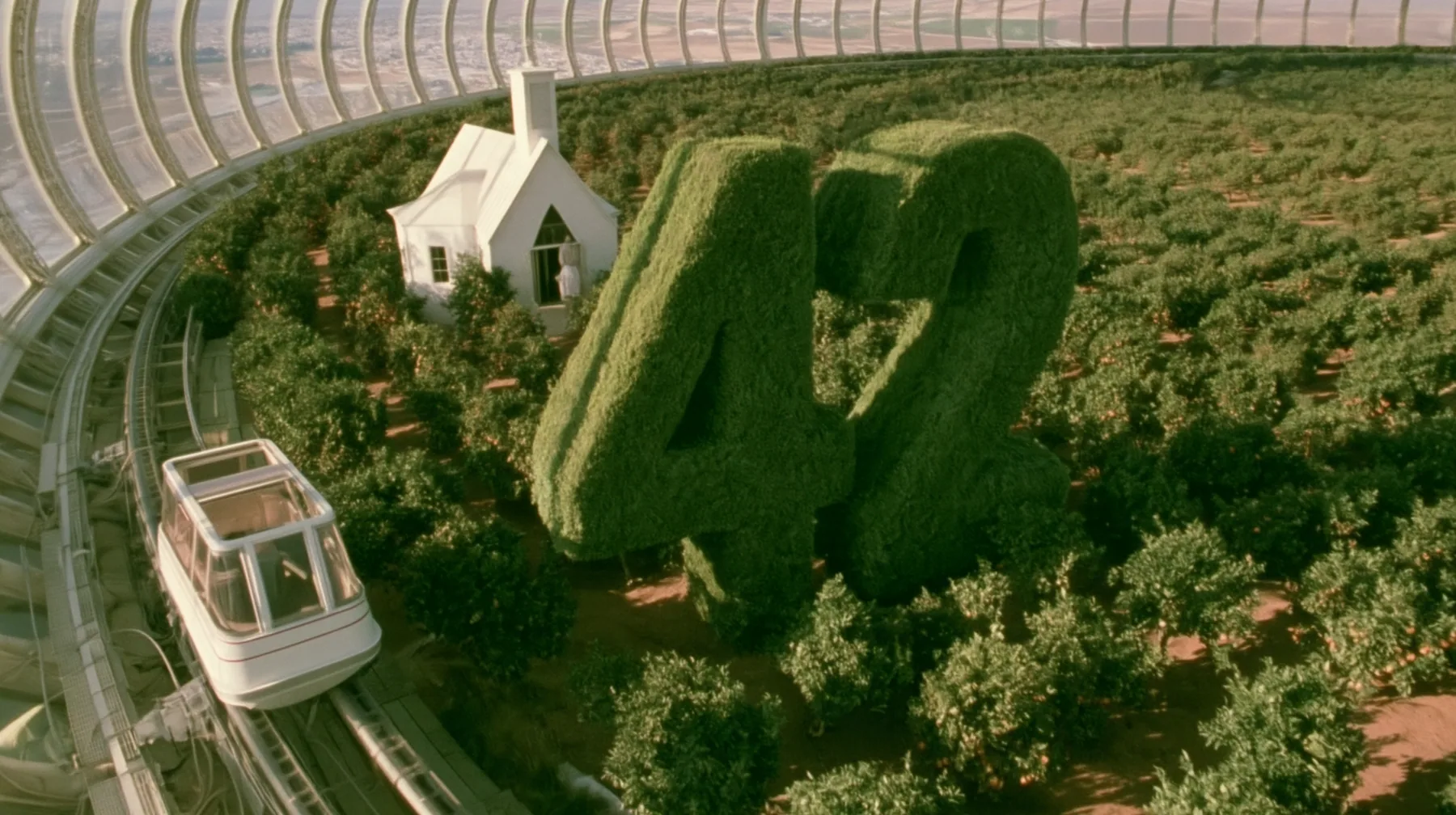 Make this the same photograph with nobody in it: remove the woman and continue the scene behind her where she stood. Keep everything else exactly: the hedges clipped into the number 42, the little white chapel and…